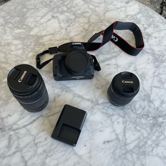 Canon Eos SL1 with case, lenses, and tripod - Picture 1 of 10